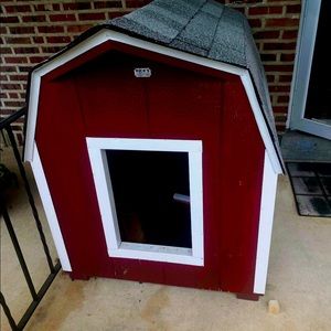 I am selling a maroon colored dog house.